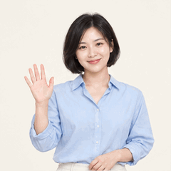 A fictional adult woman with short hair wearing a light blue shirt, animated: Smile at the camera and give a gentle wave. Keep the camera and body still.